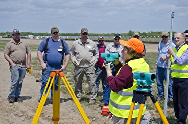 Students learn surveying with equipment
