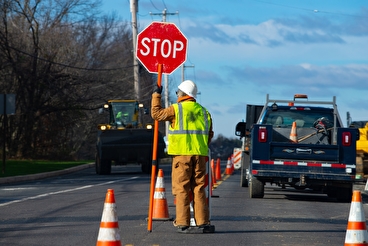 photo of work zone flagger with stop sign and cones